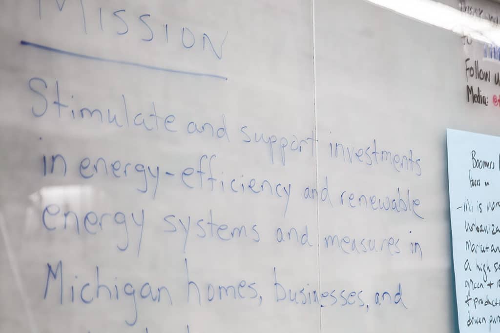 Marker writing on a whiteboard.