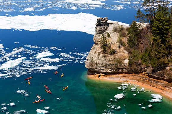 Pictured Rocks in the winter time with kayakers