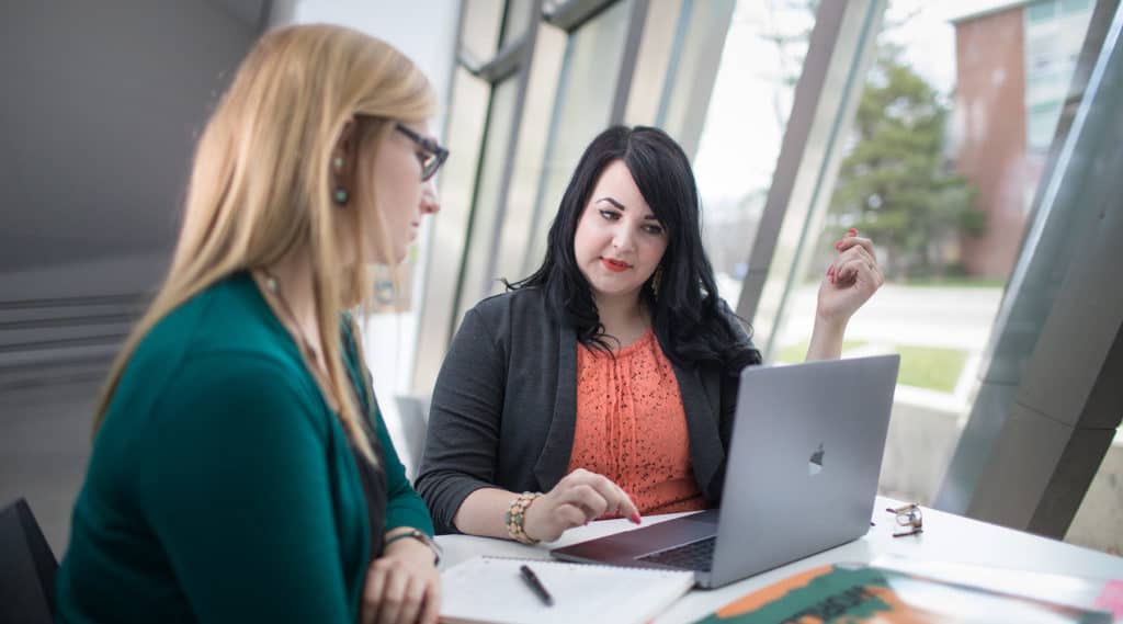 The production team at public sector consultants, collaborating on edits for a report.